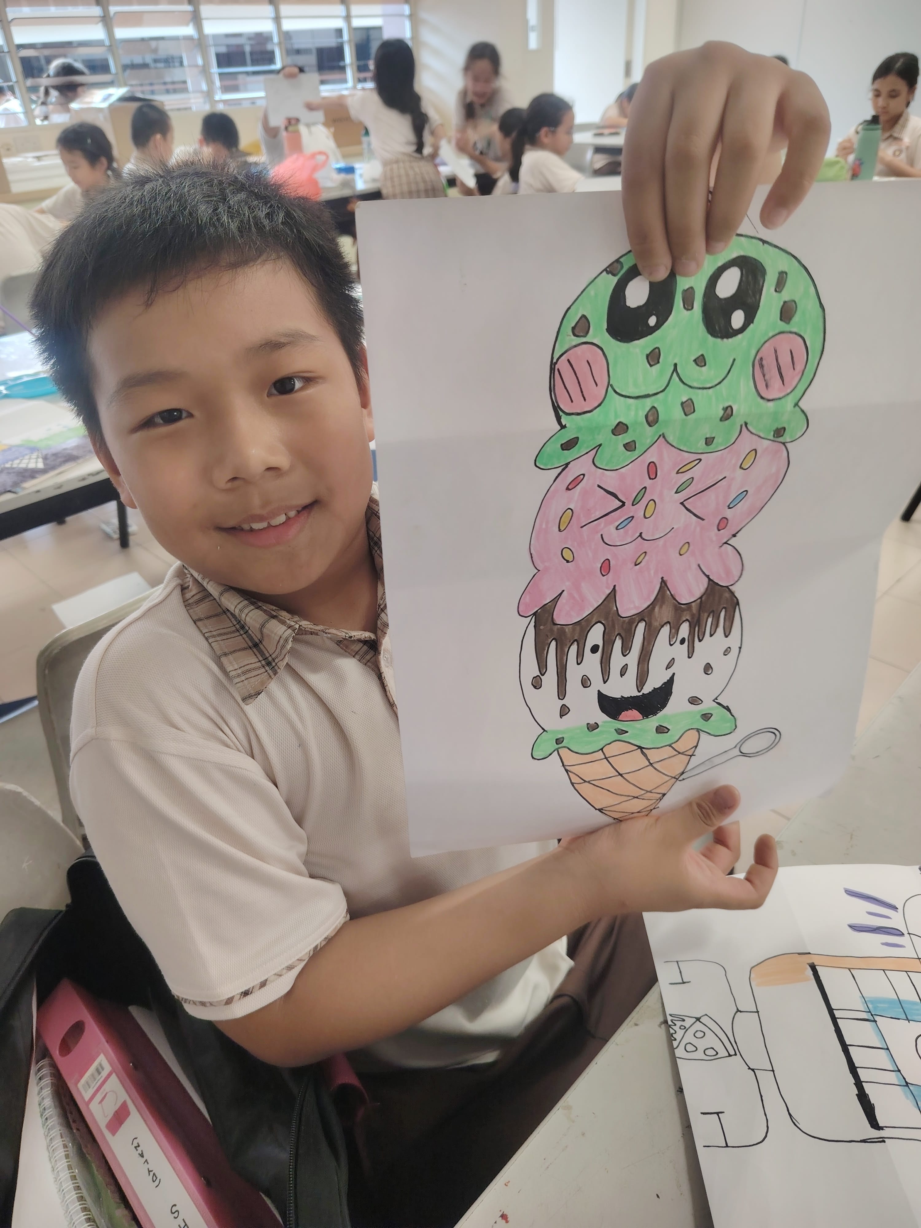A student showing his artwork